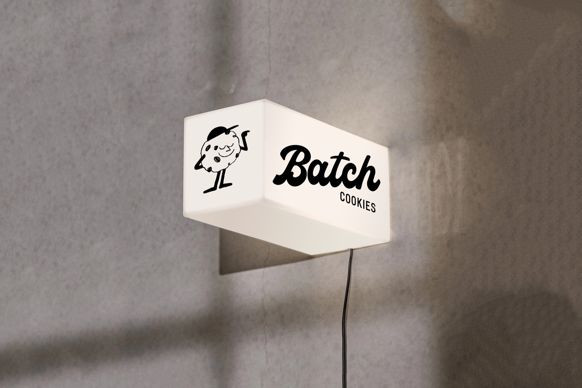 Enseigne lumineuse Batch Cookies avec le logo lettré et la mascotte cookie, à Bordeaux